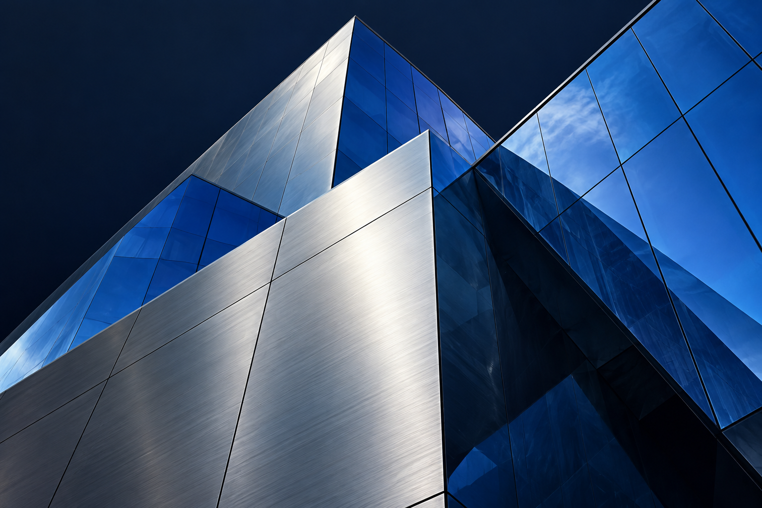 Intersecting blue glass and silver architectural planes